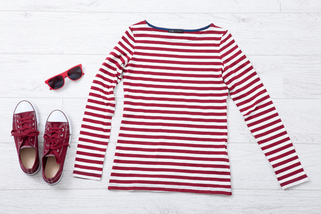 woman summer clothes collage on white wooden background, flat lay, top view mock upの写真素材
