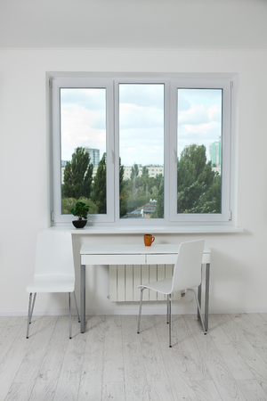 Window in an empty new apartment without curtainsの写真素材