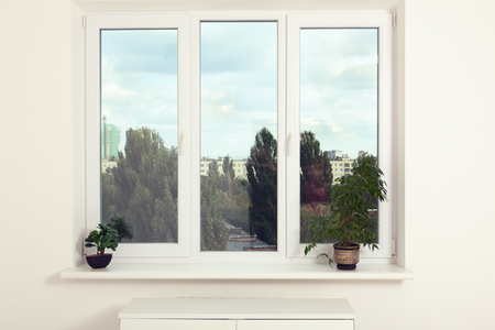 Window in an empty new apartment without curtains. Mock up.の写真素材