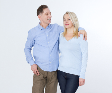 Full length portrait of happy mature couple standing with handsの写真素材