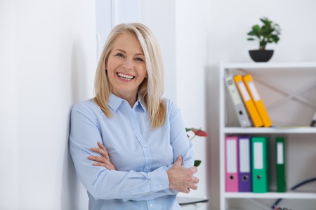 Portrait of beautiful middle aged businesswoman in office.の写真素材