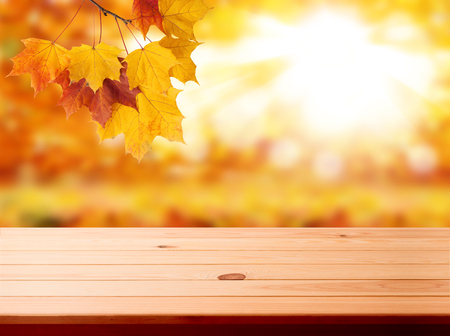 Wood table top on shiny bokeh gold backgroundの写真素材