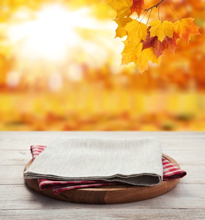 Napkin. Stack of colorful dish towels on wooden tableの写真素材