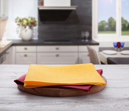 Empty pizza board with tablecloth on the tableの写真素材