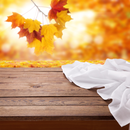 Empty wooden deck table with tablecloth.の写真素材