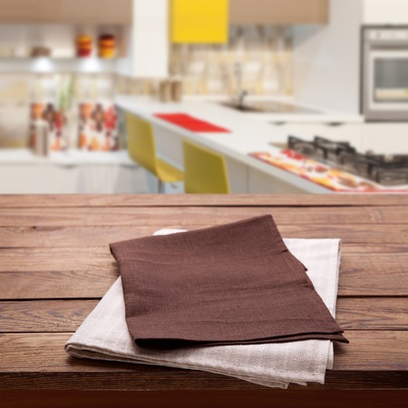 Kitchen towel on empty wooden table.の写真素材