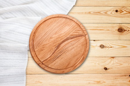 Table cloth and pizza board on vintage wooden table. Top view mockupの写真素材