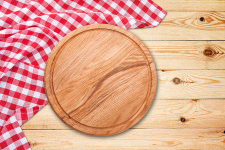 Table cloth and pizza board on vintage wooden table. Top view mockupの写真素材