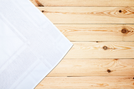 Old vintage wooden table with white tablecloth. Top view mockup.の写真素材