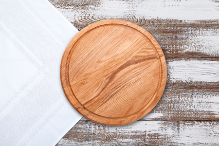 Table cloth and pizza board on vintage wooden table. Top view mockupの写真素材