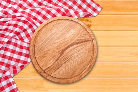 Table cloth and pizza board on vintage wooden table. Top view mockupの写真素材