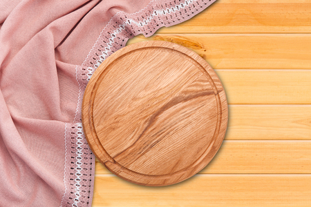 Table cloth and pizza board on vintage wooden table. Top view mockupの写真素材