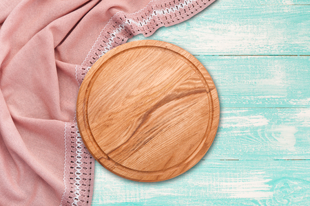 Table cloth and pizza board on vintage wooden table. Top view mockupの写真素材