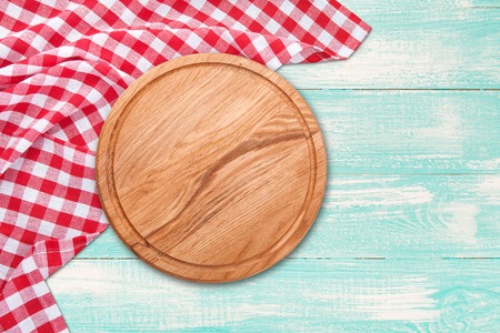 Table cloth and pizza board on vintage wooden table. Top view mockupの写真素材