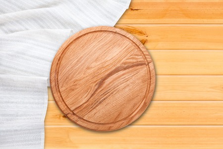 Table cloth and pizza board on vintage wooden table. Top view mockupの写真素材