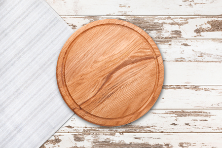 Table cloth and pizza board on vintage wooden table. Top view mockupの写真素材