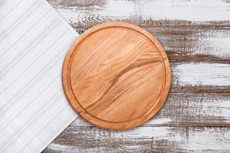 Table cloth and pizza board on vintage wooden table. Top view mockupの写真素材