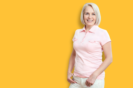 Friendly smiling middle-aged woman isolated on white backgroundの写真素材