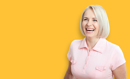 Friendly smiling middle-aged woman isolated on white backgroundの写真素材