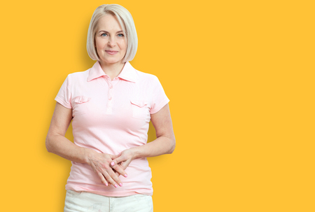 Friendly smiling middle-aged woman isolated on white backgroundの写真素材