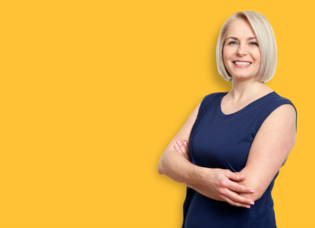 Friendly smiling middle-aged business woman isolated on white baの写真素材