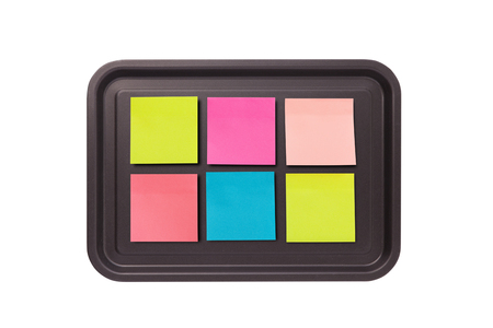 collection of colorful stick note on baking tray, isolated on white backgroundの写真素材