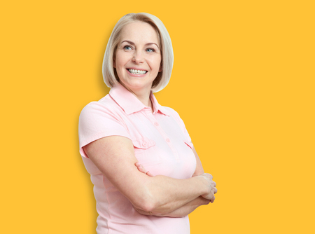 Friendly smiling middle-aged woman isolated on white backgroundの写真素材