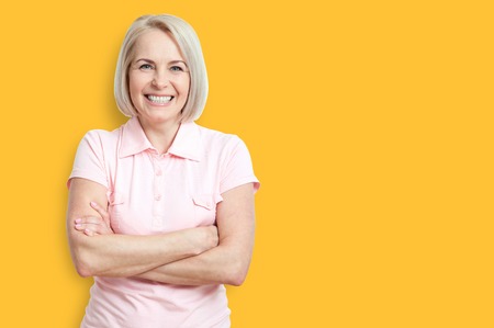 Friendly smiling middle-aged woman isolated on white backgroundの写真素材