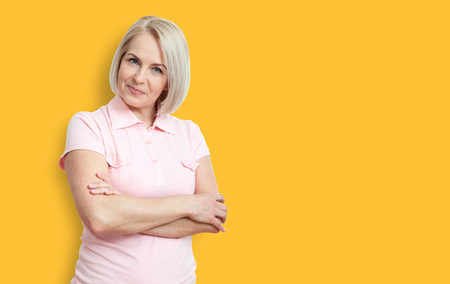 Friendly smiling middle-aged woman isolated on white backgroundの写真素材