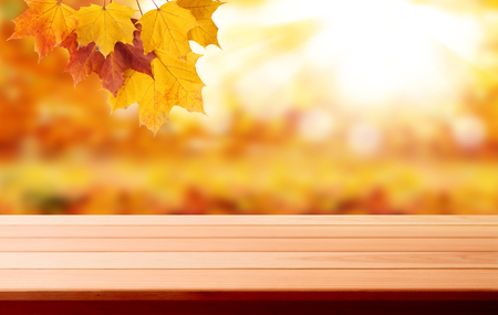 Wood table top on shiny bokeh gold background - can be used for display or montage your productsの写真素材