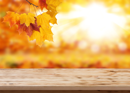 Wood table top on shiny bokeh gold background - can be used for display or montage your productsの写真素材