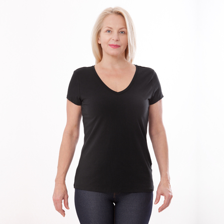 T-shirt design and people concept - close up of woman in blank black t-shirt, shirt front isolated. Mock up.の写真素材