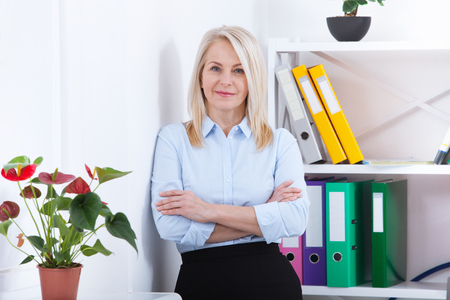 Modern business woman in office with copy spaceの写真素材