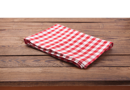 Kitchen towel on empty wooden table. Napkin close up top view mock up for design.の写真素材