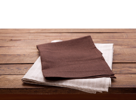 Wooden deck table with tablecloth isolated on white.の写真素材
