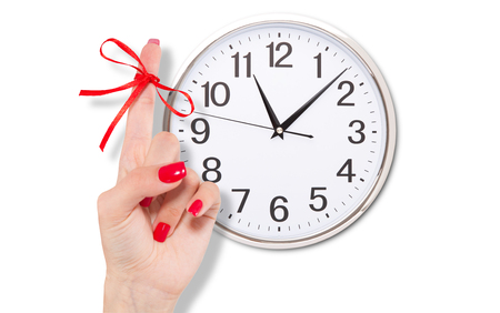 Red bow on finger and clock isolated on white.の写真素材
