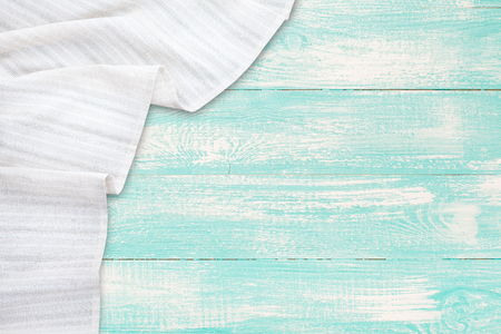 Old vintage wooden table with white tablecloth. Top view mockup.の写真素材