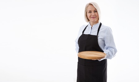 Attractive woman gives empty pizza board for your advertising products isolated on whiteの写真素材