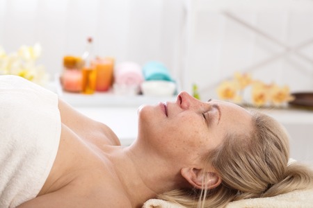 Portrait of beautiful woman in spa environmentの写真素材