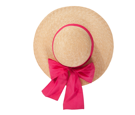 Pretty straw hat with ribbon and bow on whiteの写真素材