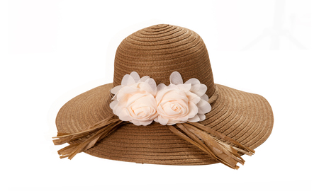 Pretty straw hat with ribbon and bow on whiteの写真素材