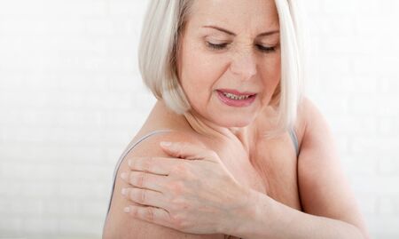 Woman with a pain in the body. Concept photo with indicating location of the pain. Health care conceptの写真素材