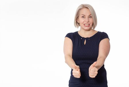 Happy woman emotionally posing in studio. Middle aged woman on white backgroundの写真素材