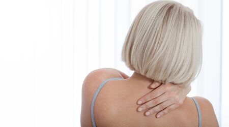 Woman with pain in shoulder. Pain in the human body,health care concept.の写真素材