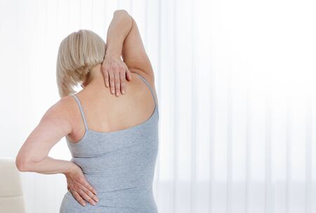 Woman with a pain in the body. Concept photo with indicating location of the pain. Health care conceptの写真素材