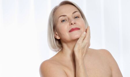 Beauty Woman with perfect skin Portrait. Plastic surgery collagen injections. Macro face. Selective focus on face. Realistic images with their own imperfections.の写真素材