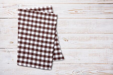 Napkin. Kitchen towel or table cloth on white wooden scene. Mock up for design. Top view mockup.の写真素材