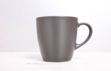 Mug Mockup. Gray Mug on wooden table.の写真素材