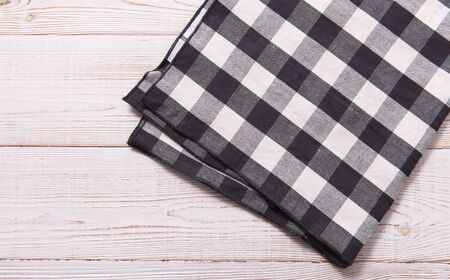 Napkin. Kitchen towel or table cloth on white wooden scene. Mock up for design. Top view mockup.の写真素材