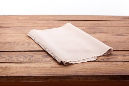 Tablecloth on wooden table on kitchen. Canvas, dish towels on kitchen top view mock up. Selective focus.の写真素材